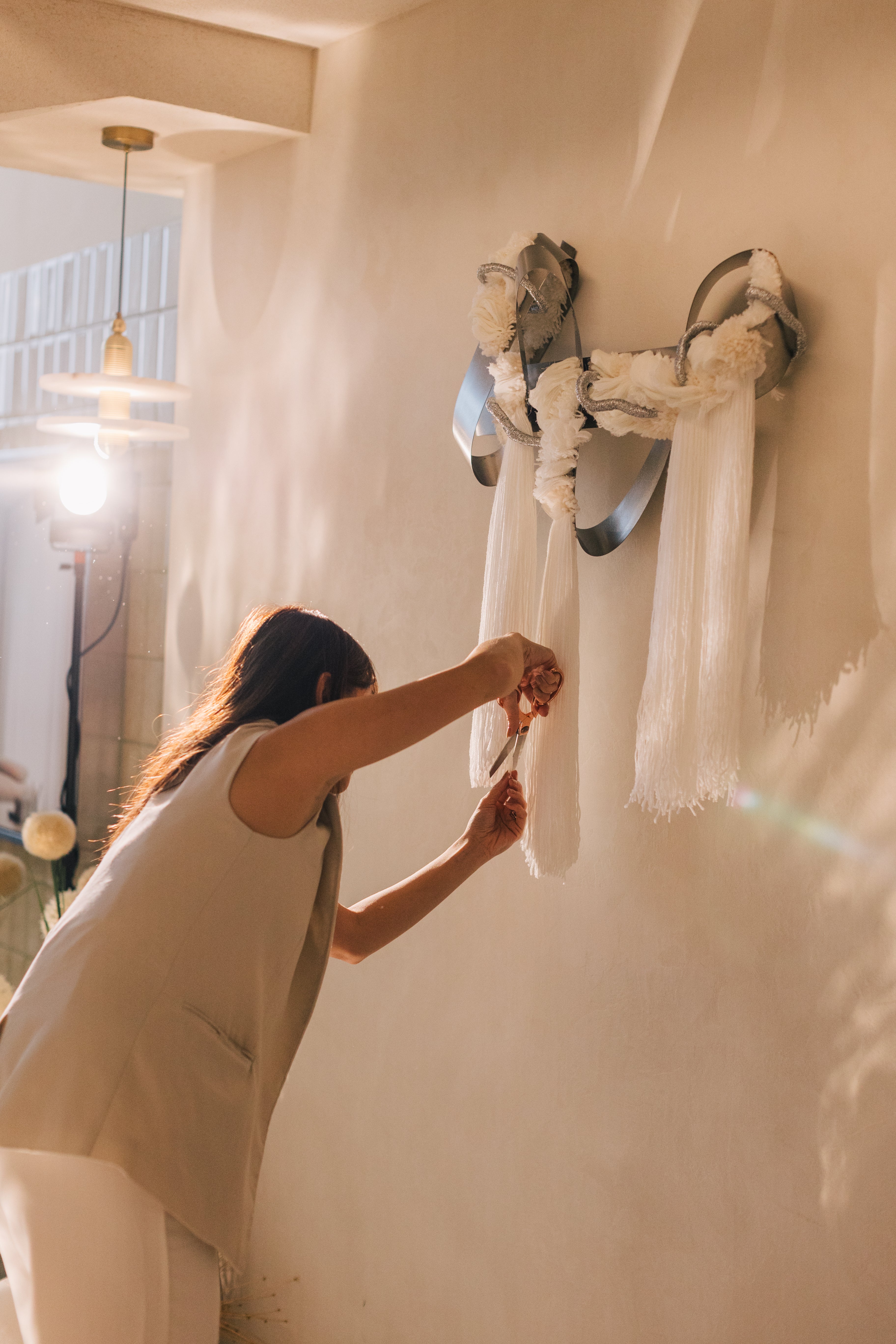 Detail of The Morning Glow’s weave — interlaced golden yarn forming a luminous, sculptural pattern reminiscent of morning light.