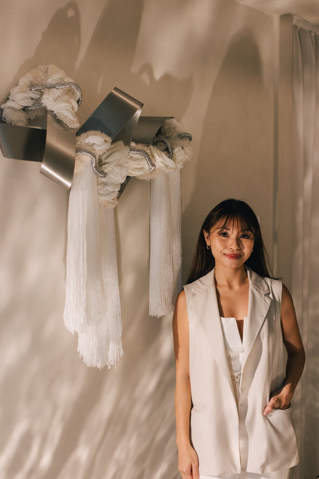 Side angle of The Morning Glow wall hanging, showing its three‑dimensional shape and sun-inspired curvature. 