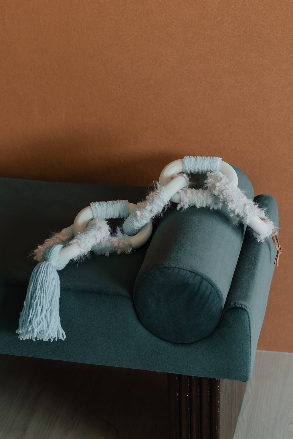 Side profile of Passing By Blooms Delphinium fibre art, showing its depth and dimensional weave of lavender hues.