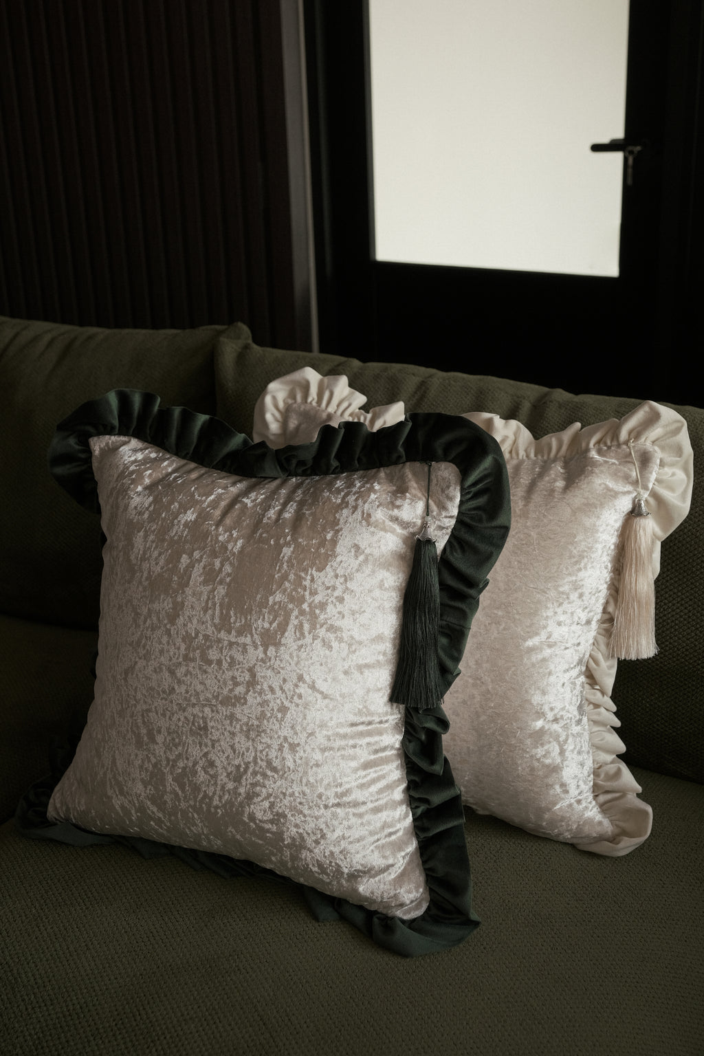 Scented throw cushion styled on sofa — green cushion adding hygge and subtle fragrance. 