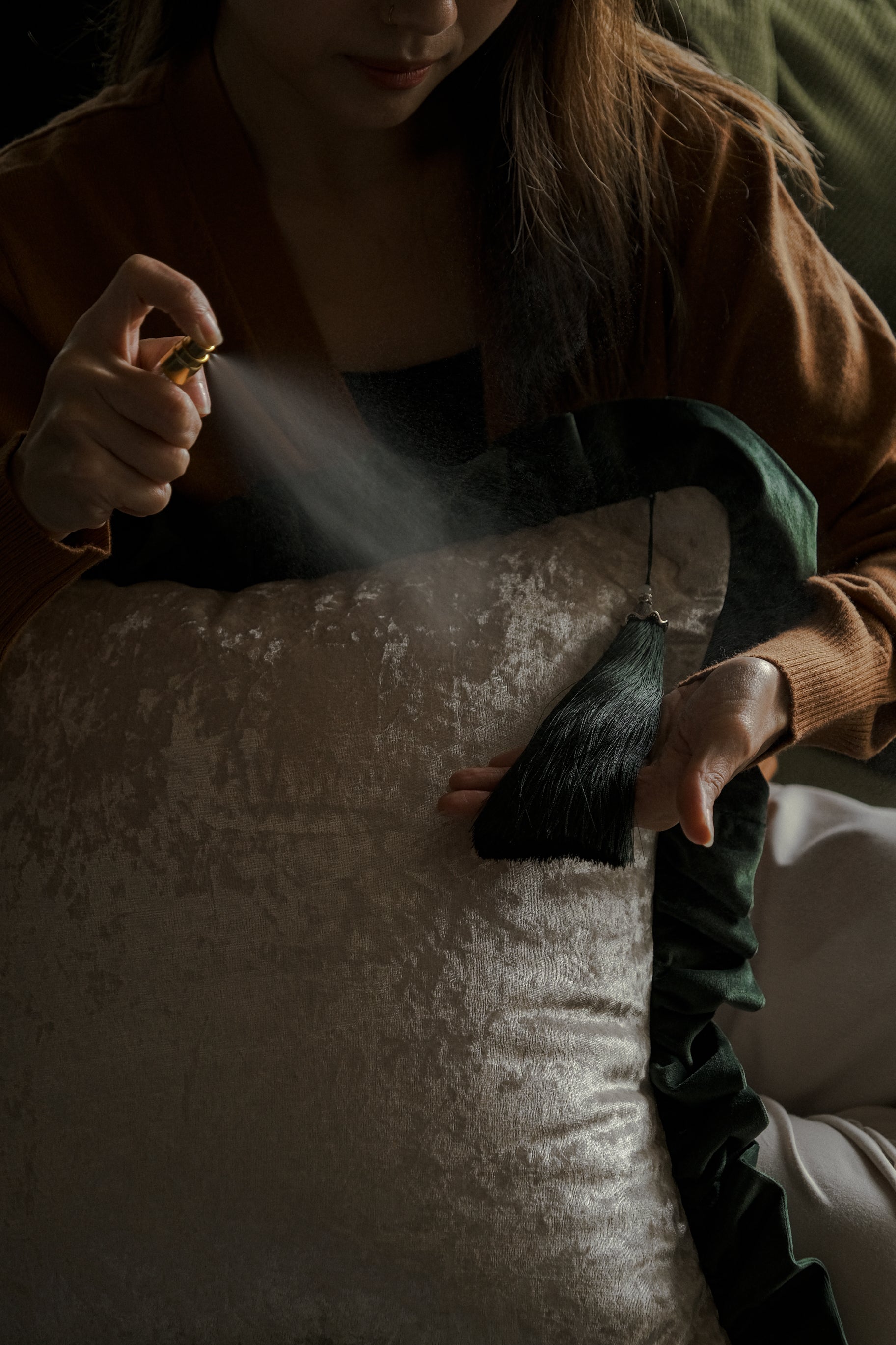 Hunter-green scented throw cushion giving cozy vibe to living room setup.