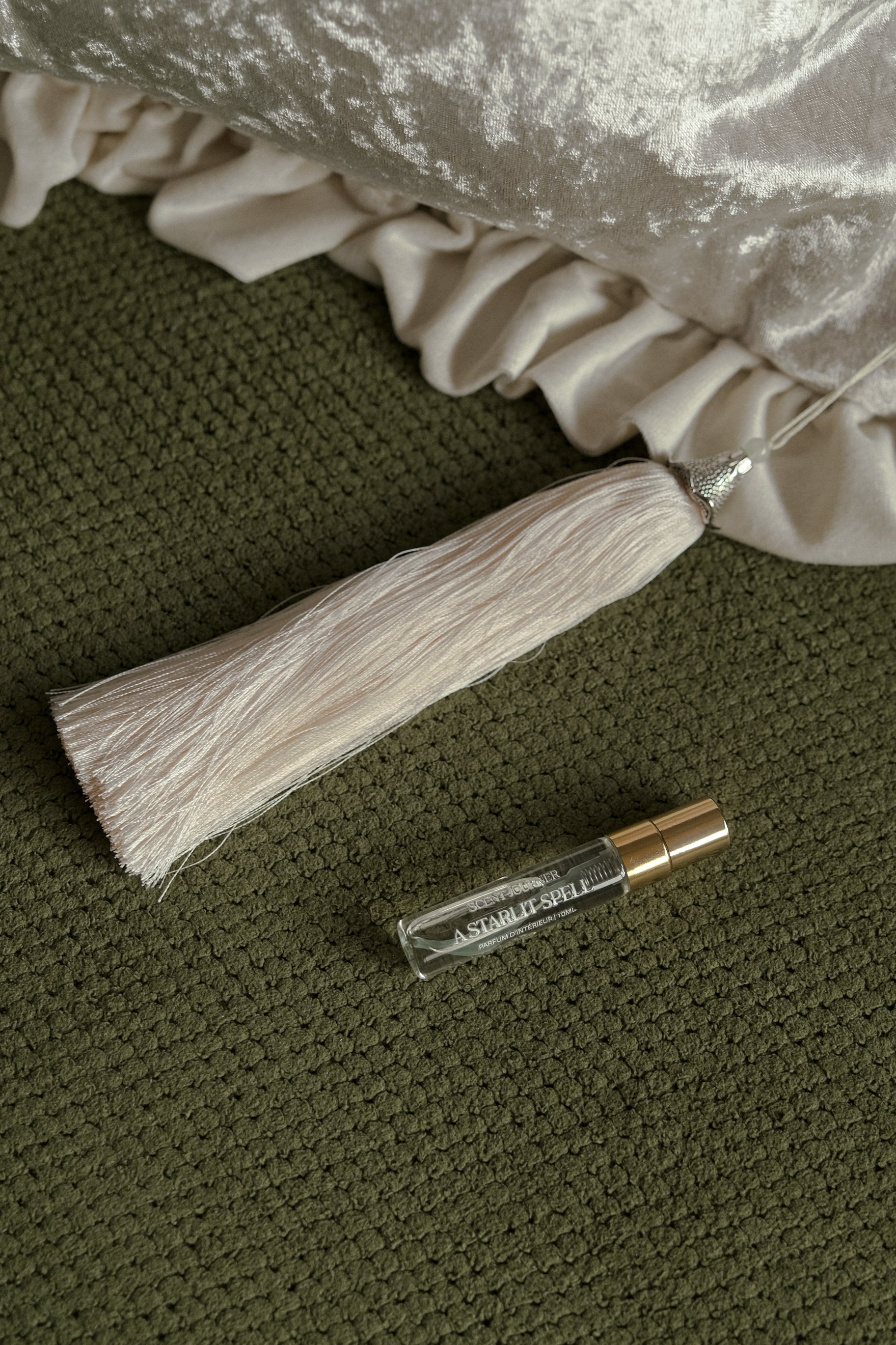 Close-up of luxurious velvet texture on scented throw cushion, Beeyarnd x Scent Journer.