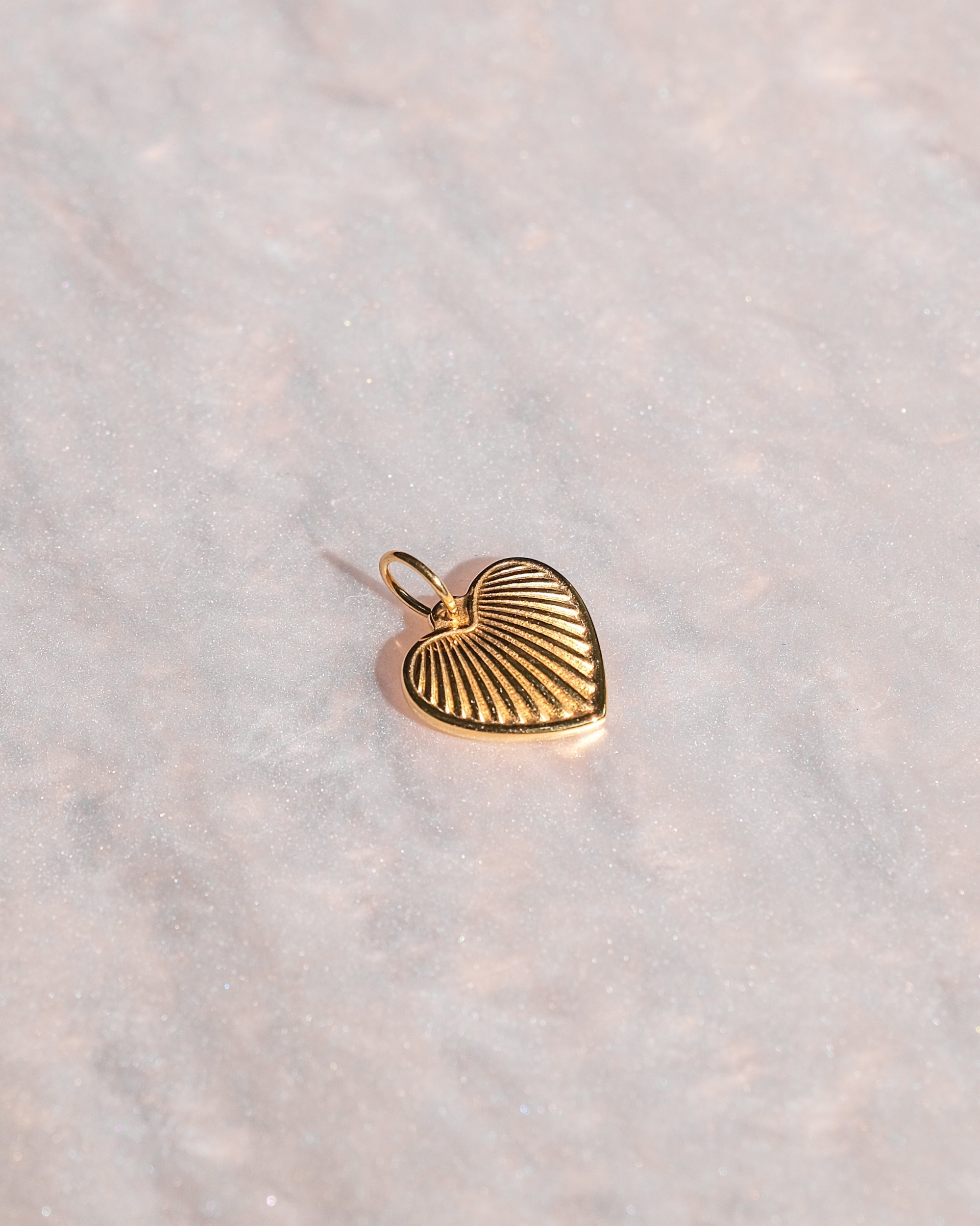 Exclusive charm with limited edition pendant designed for luxury handbags.