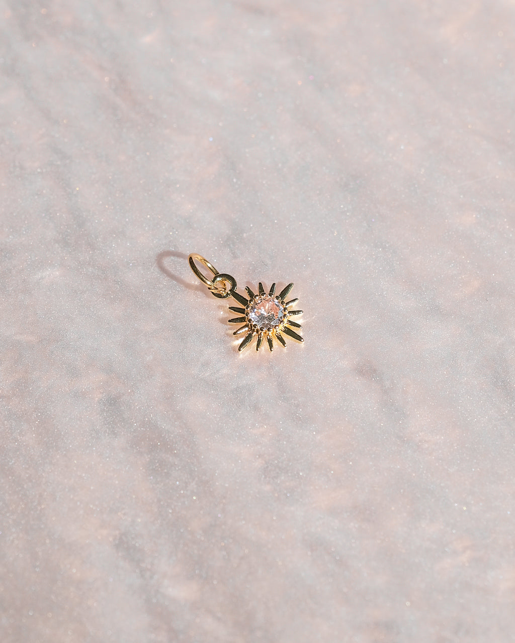 Exclusive charm with limited edition pendant designed for luxury handbags.