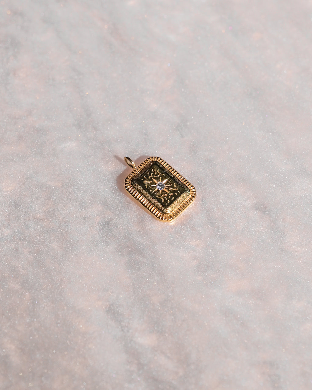 Exclusive limited edition pendant charm displayed on neutral background.