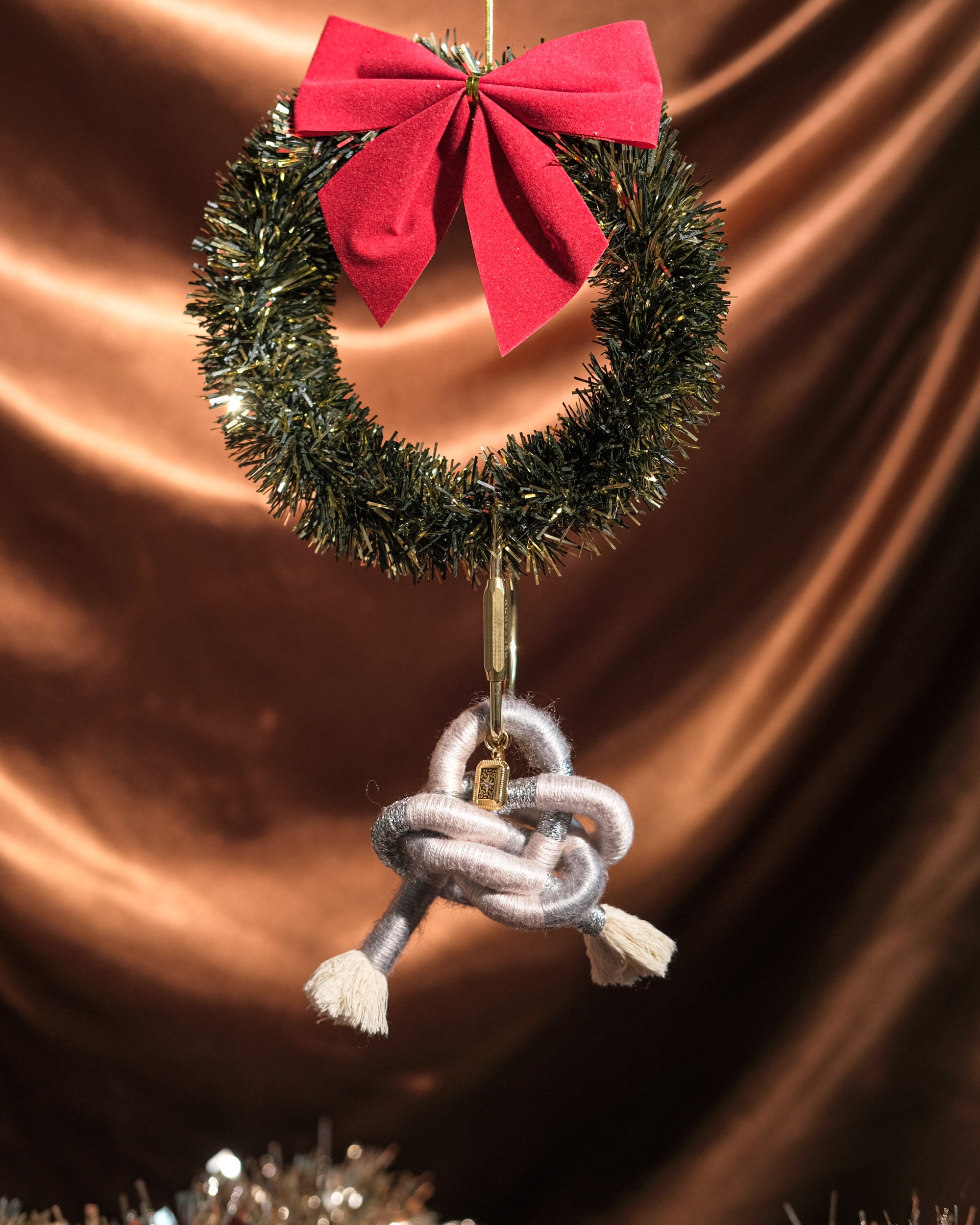 Limited edition pendant bag charm on a festive background – silver and gold accent