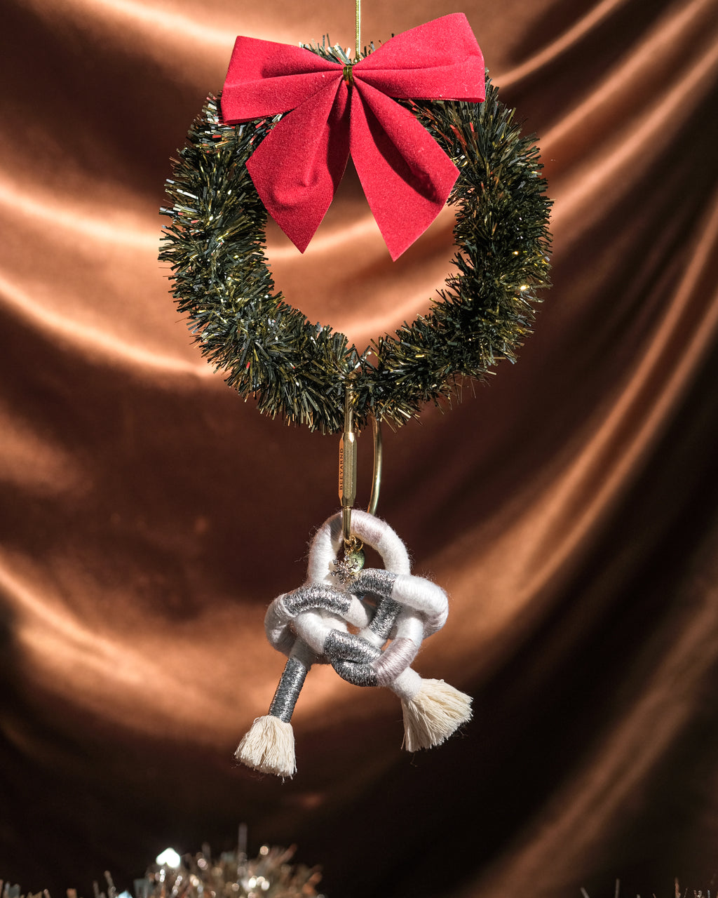Handmade Snow Angel Ethereal bag charm detail – pendant, knot, and tassels against festive backdrop.