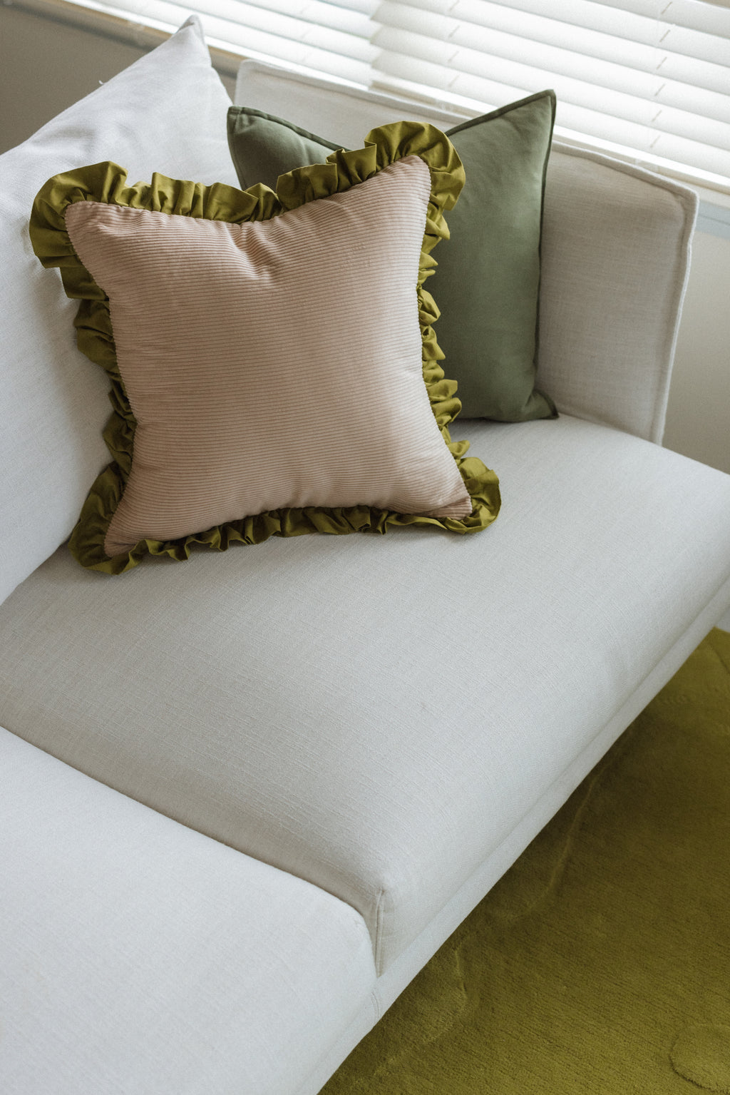 Handmade Good Vibes chartreuse cushion with soft plush fabric texture and vibrant tone on neutral background.