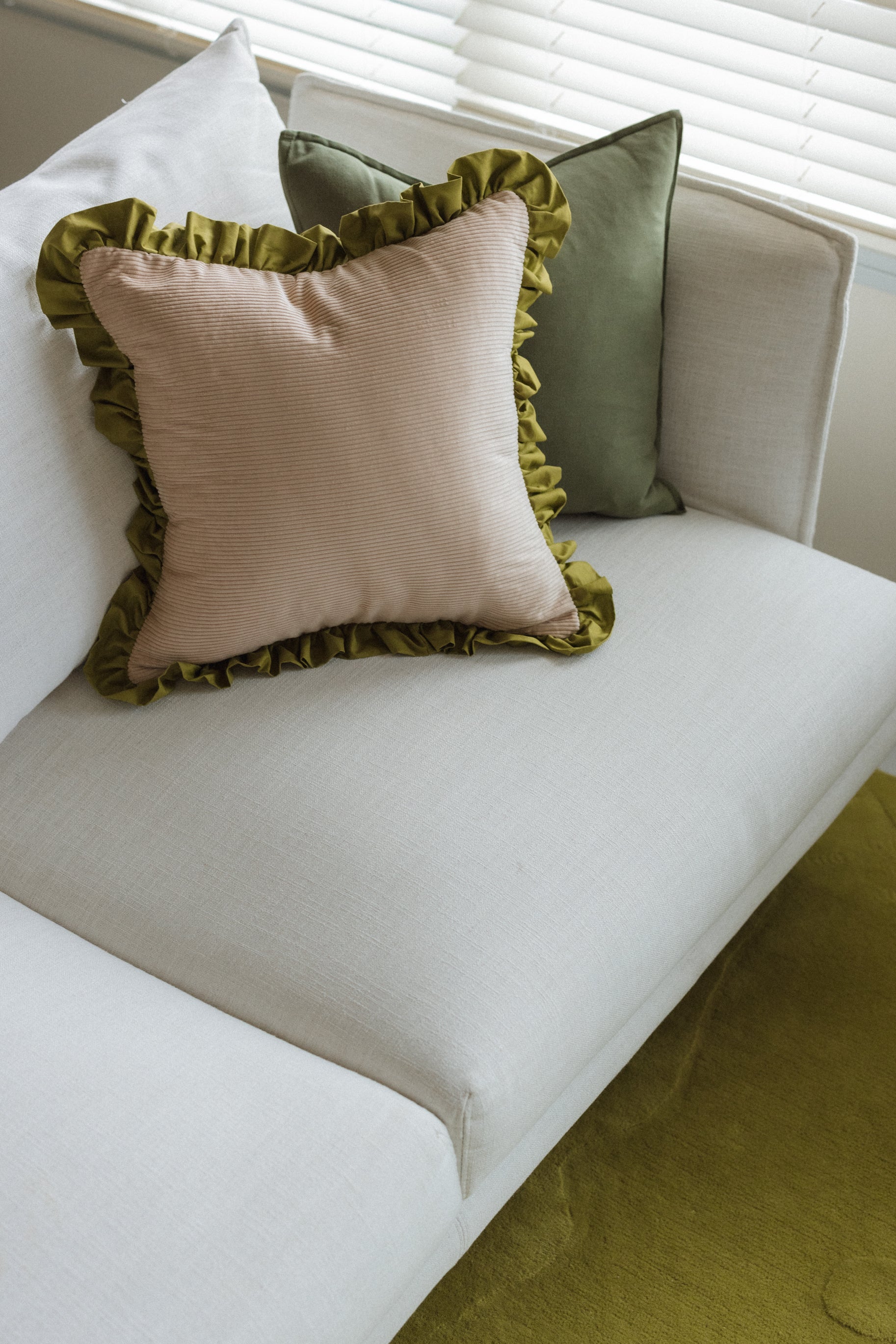 Handmade Good Vibes chartreuse cushion with soft plush fabric texture and vibrant tone on neutral background.