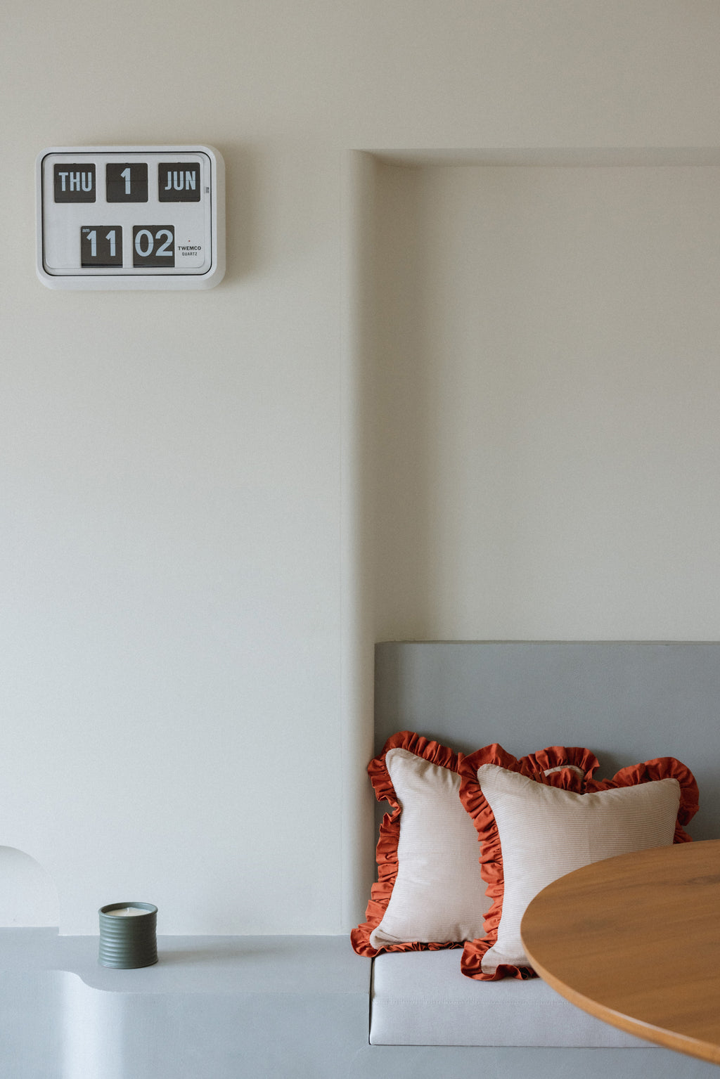 Cozy home décor photo — Warm Hugs Rust Cushion creating warm atmosphere on sofa.