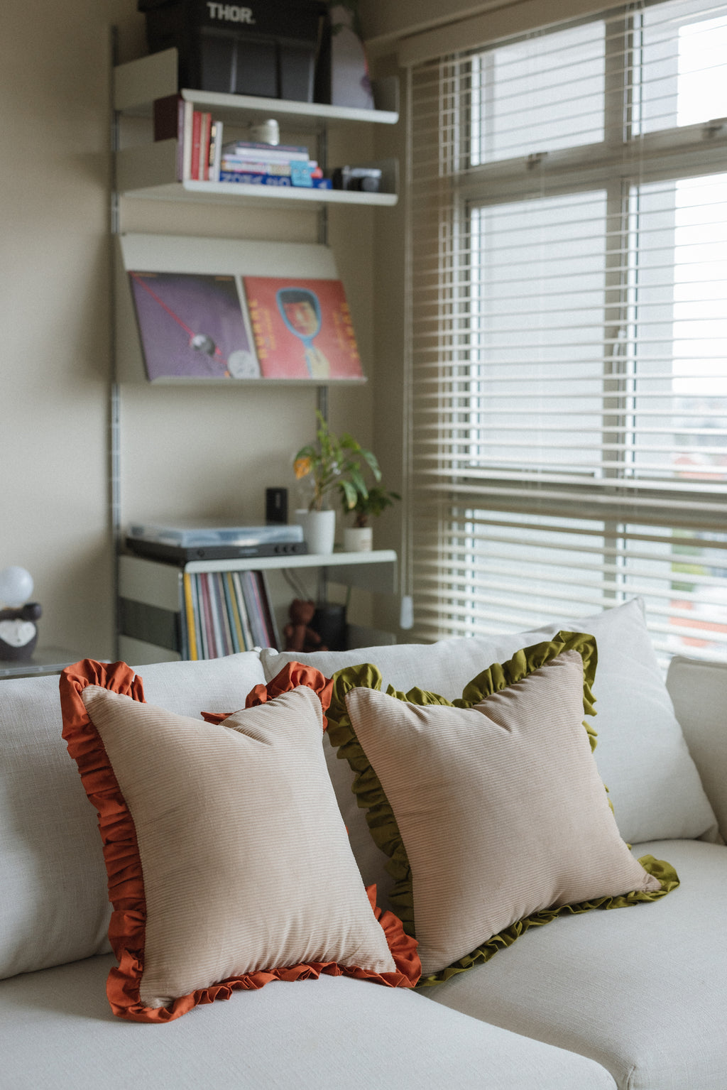 Square decorative cushion Good Vibes in vibrant chartreuse — ideal for adding cheerful vibe to room.