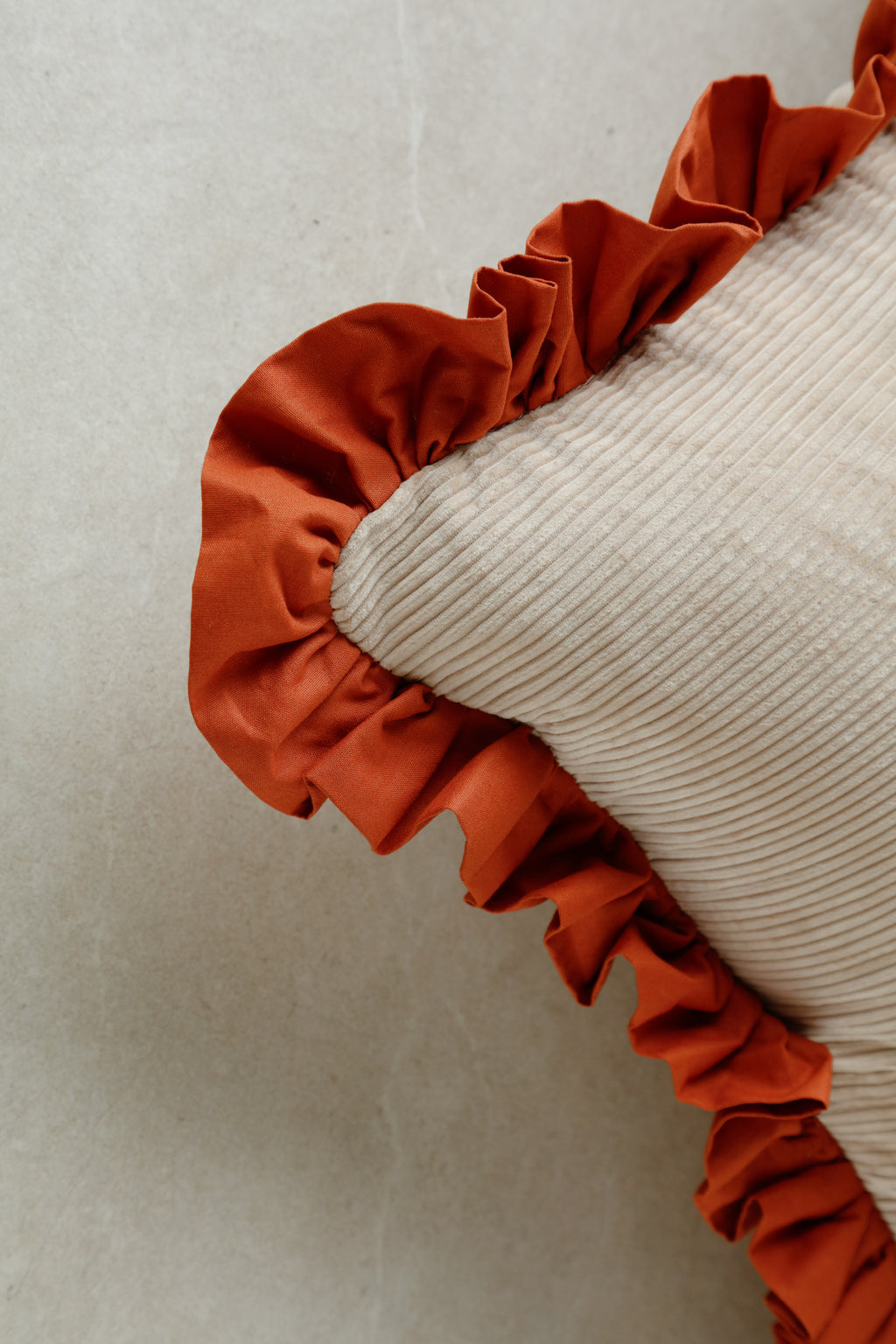 Square Warm Hugs Velvet cushion in rust tone with soft plush texture and clean lines.