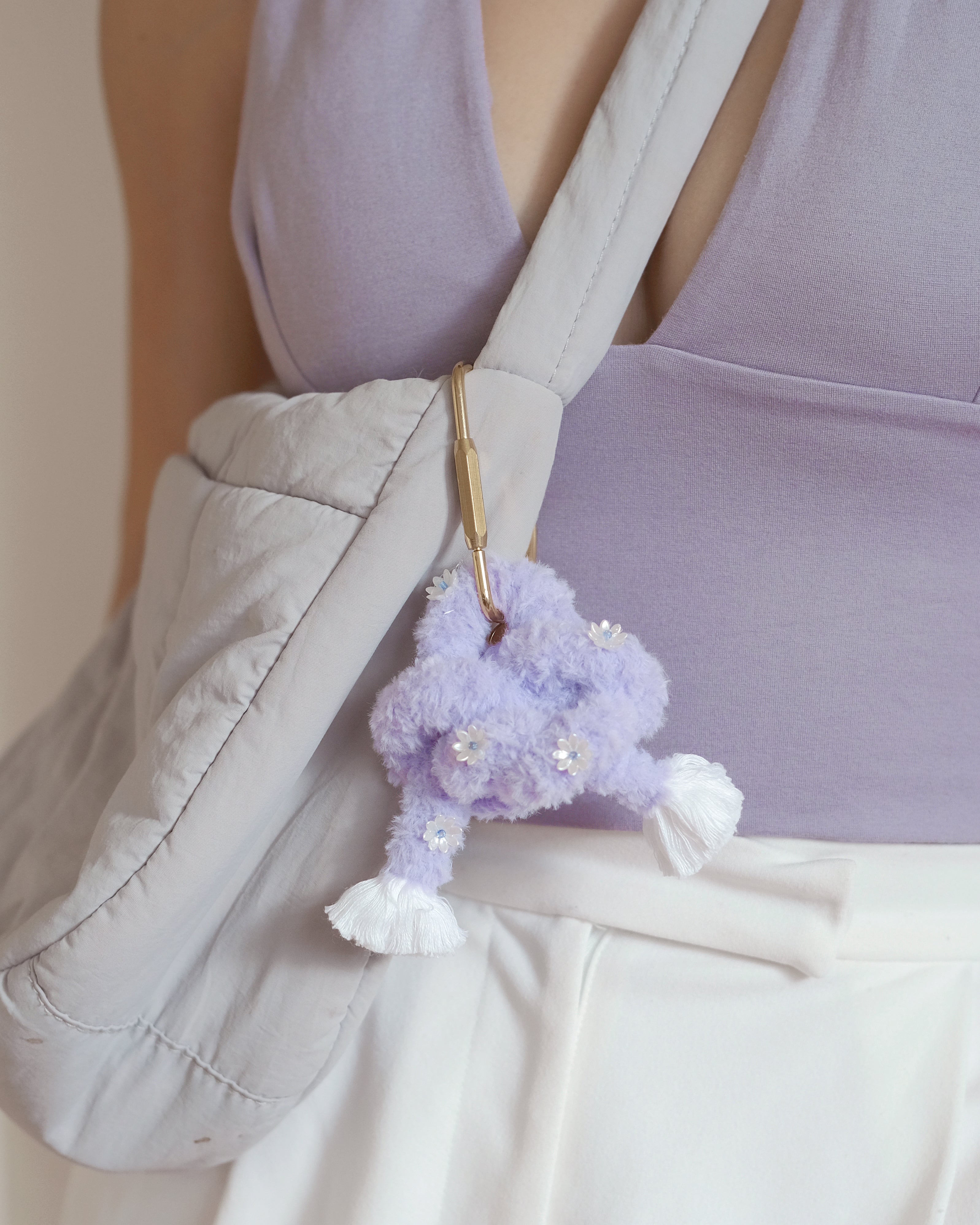 Handcrafted unicorn charm with ethereal pastel colors and silver ring, perfect for bags or keys.