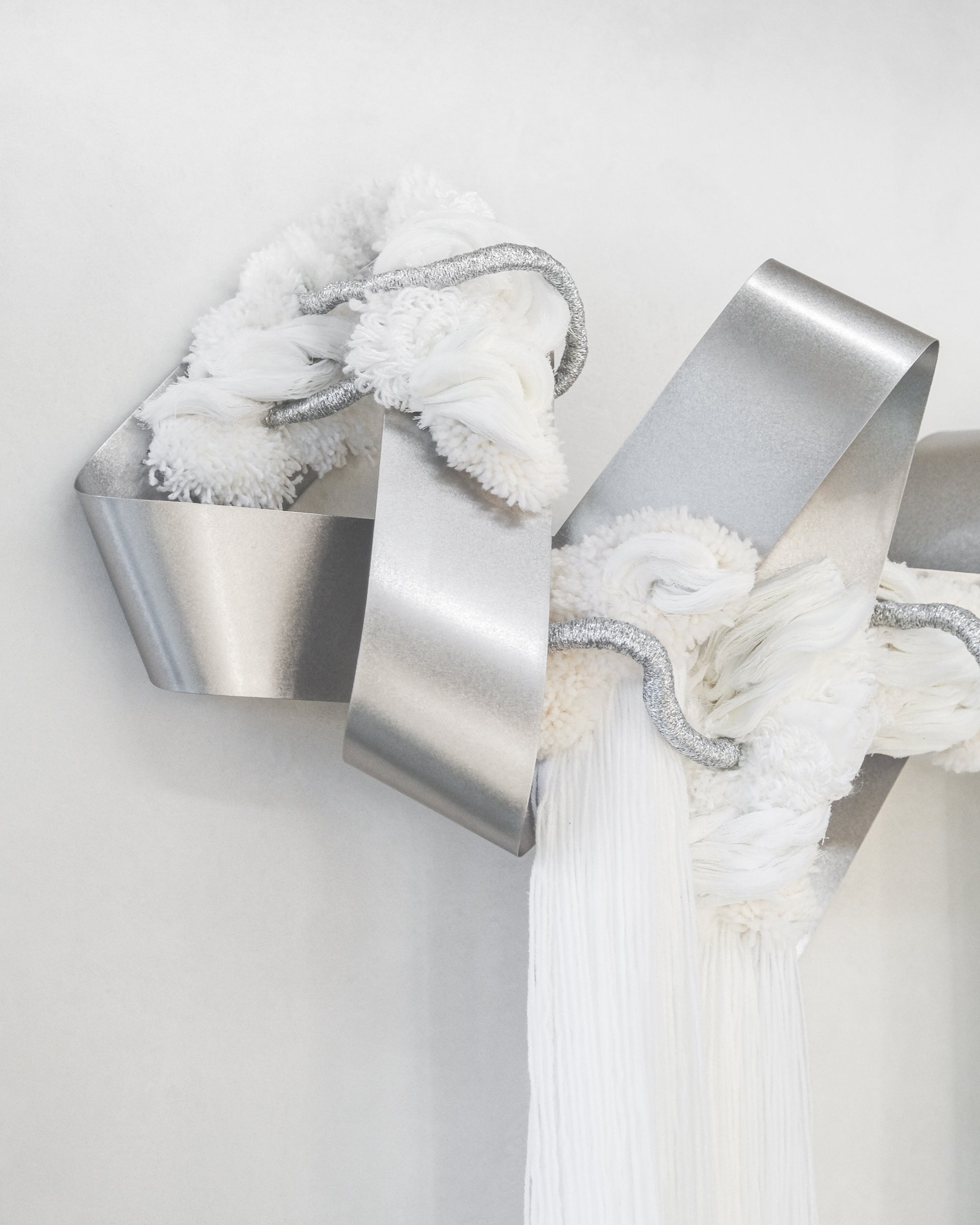 Close‑up of The Morning Glow: layered thread in warm yellow and cream, creating a glowing, textured sunrise effect.